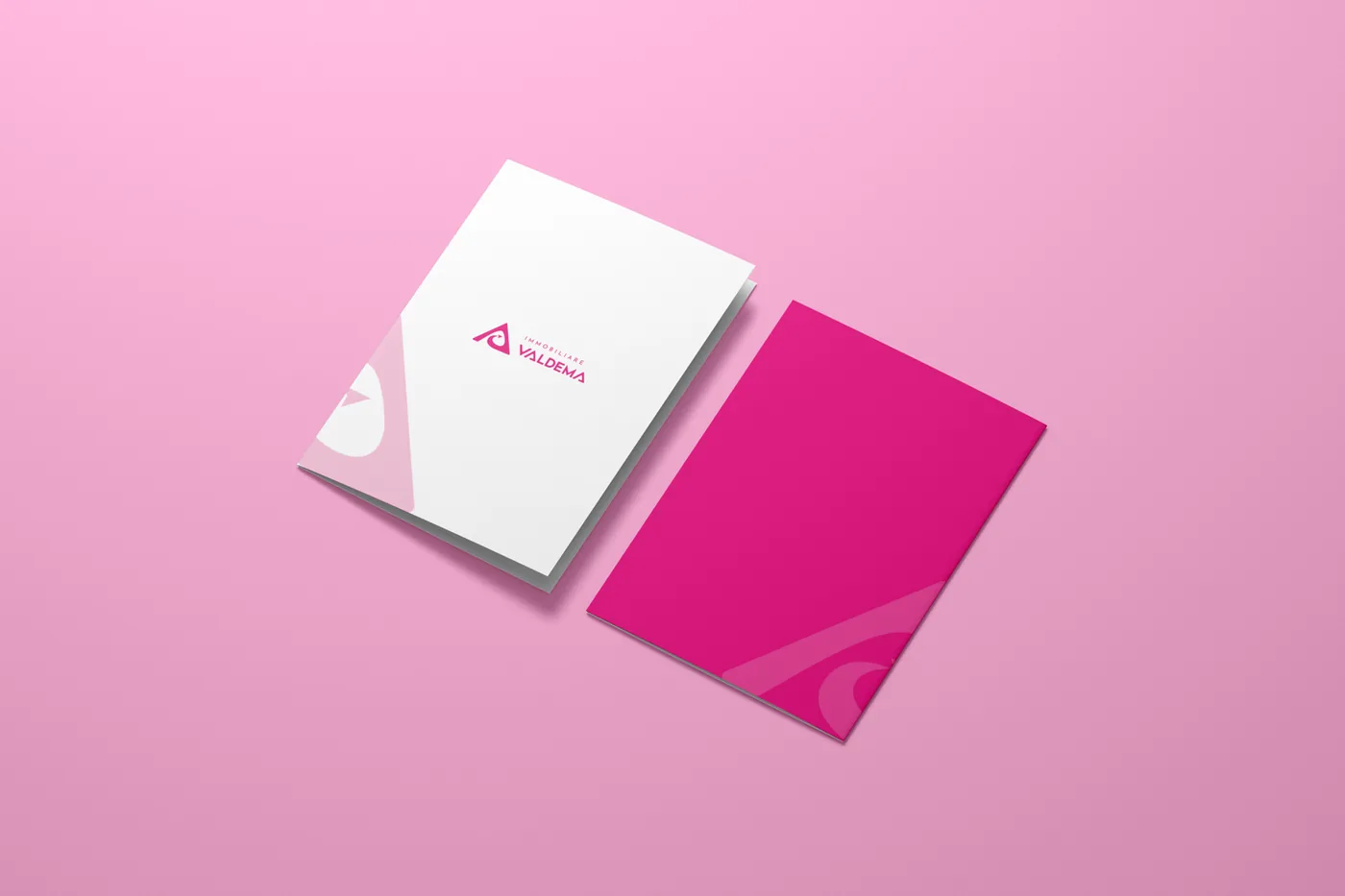 Pink brand stationery for a real estate agency: letterhead, envelope and logo