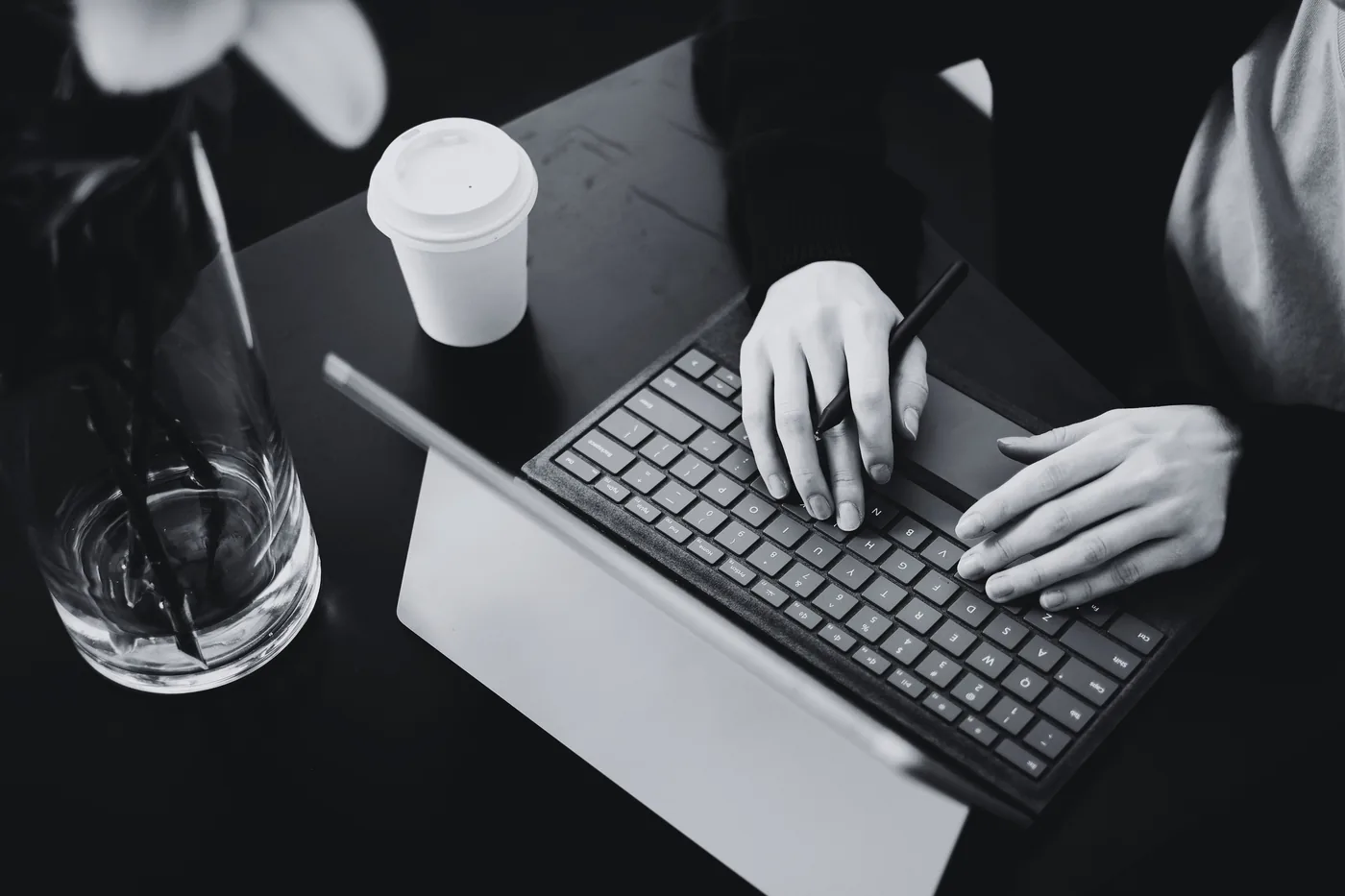 Designer working on a laptop at a desk